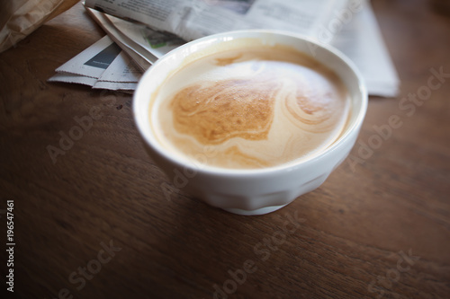 Cafe au lait and newspaper photo