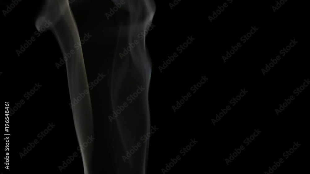 Beautiful gray smoke on a black background. Cigarette smoke. Smoke from the hookah. Turbulence of smoke. The white vapor rises. The smoke slowly flies. Beautiful gray smoke on a black background. Cigarette smoke. Smoke from the hookah. Turbulence of smoke. The white vapor rises. The smoke slowly flies.
