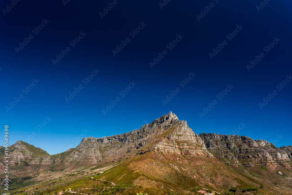 View of the Table Mountain's Top on a sunny Day with deep blue Sky in Cape Town, South Africa