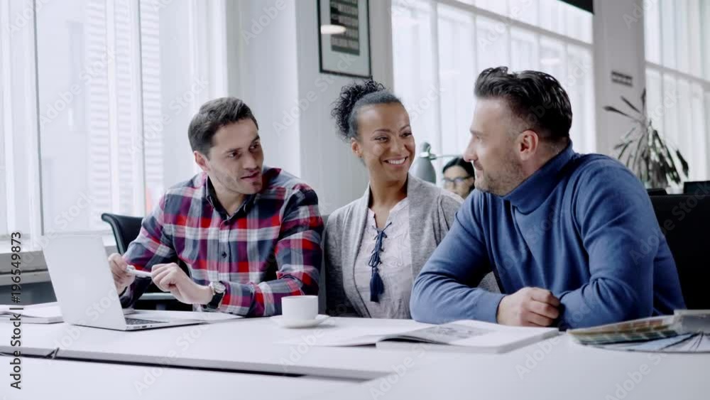 Multi-ethnic colleagues in a coworking office. Multi-ethnic colleagues in a coworking office.
