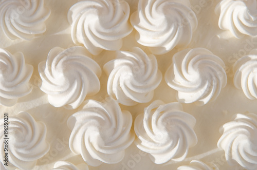 White cream on cake in the sun. Background, texture
