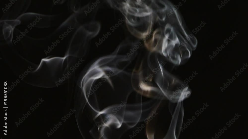 Beautiful gray smoke on a black background. Cigarette smoke. Smoke from the hookah. Turbulence of smoke. The white vapor rises. The smoke slowly flies. Beautiful gray smoke on a black background. Cigarette smoke. Smoke from the hookah. Turbulence of smoke. The white vapor rises. The smoke slowly flies.