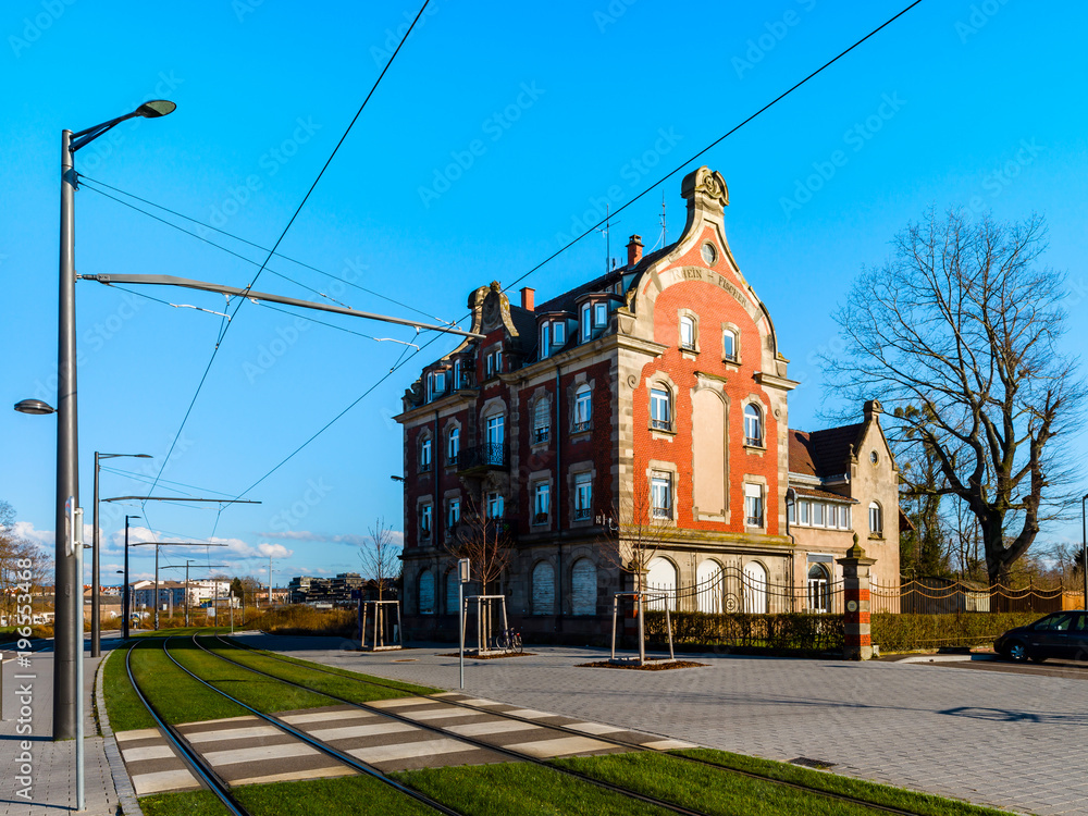 Obraz premium Comfort city environment in Strasbourg. Old classic house and new modern tramway line