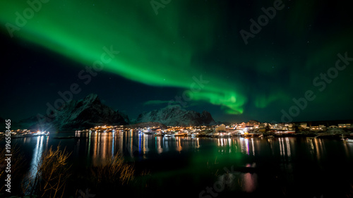 Northern lights over the vilage of Reine, Lofoten, Norway © bannkie