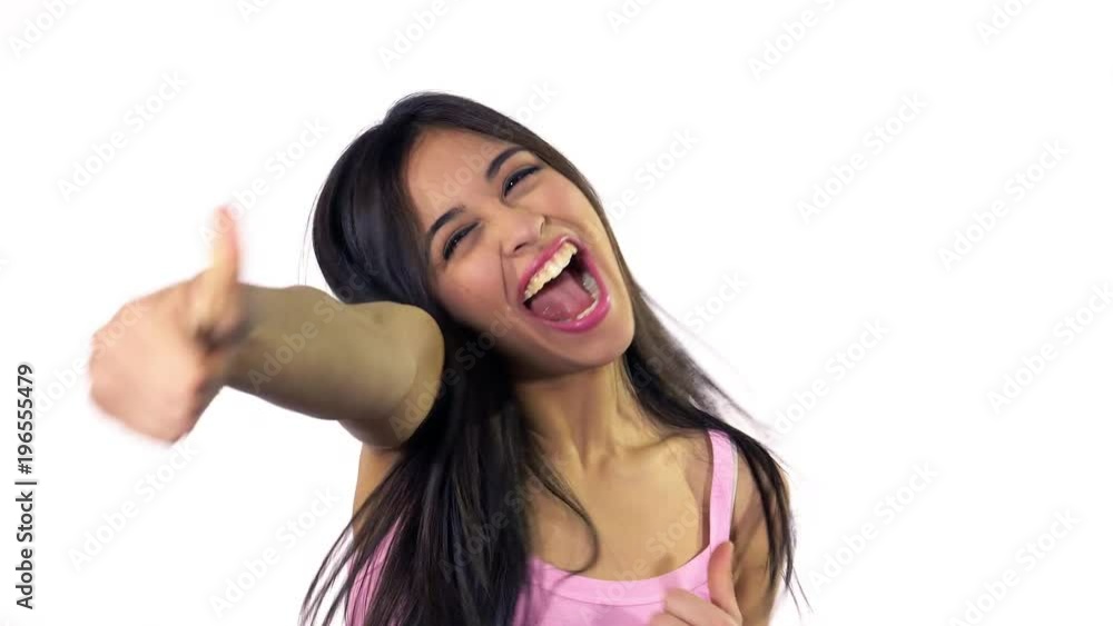 Happy cute lating young woman jumping showing ok sign smiling medium shot Happy cute lating young woman jumping showing ok sign smiling medium shot
