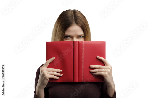 Young woman with a book studio portrait