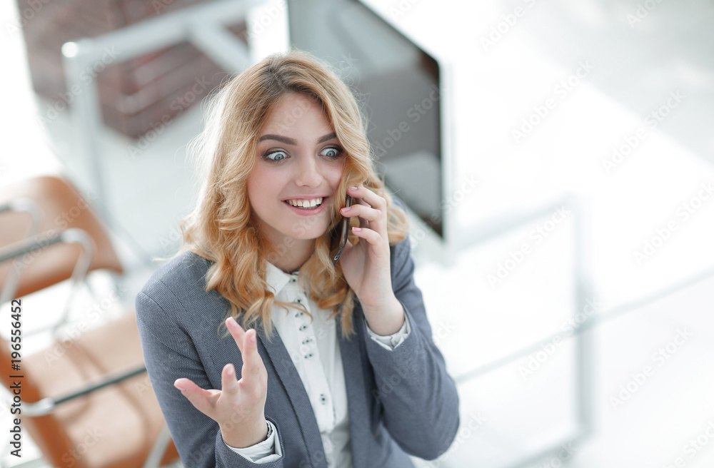 happy employee is talking on the smartphone happy employee is talking on the smartphone
