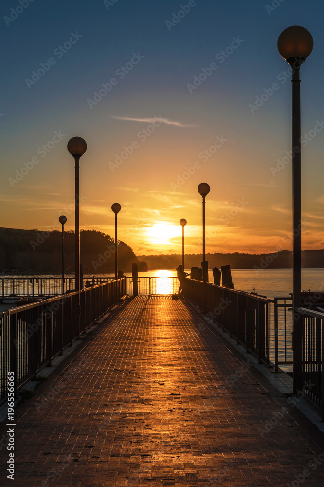 Anguillara Sabazia, Italy - The Bracciano lake at sunset from the old stone town on the waterfront named Anguillara Sabazia, province of Rome, central italy