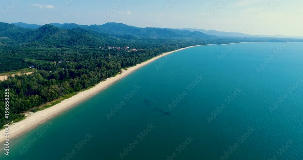 Aerial drone view of beautiful tropical island with sandy beach during sunny summer day