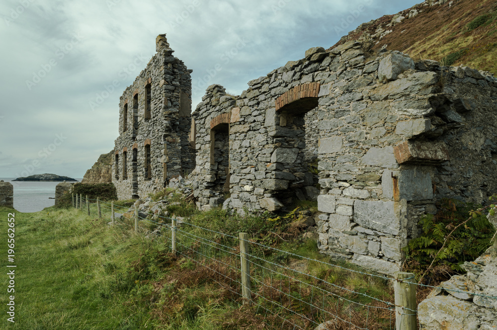 The abandoned ruined factory buildings of the Llanlleiana old porcelain works at Llanbadrig, Cemaes Bay, Anglesey.