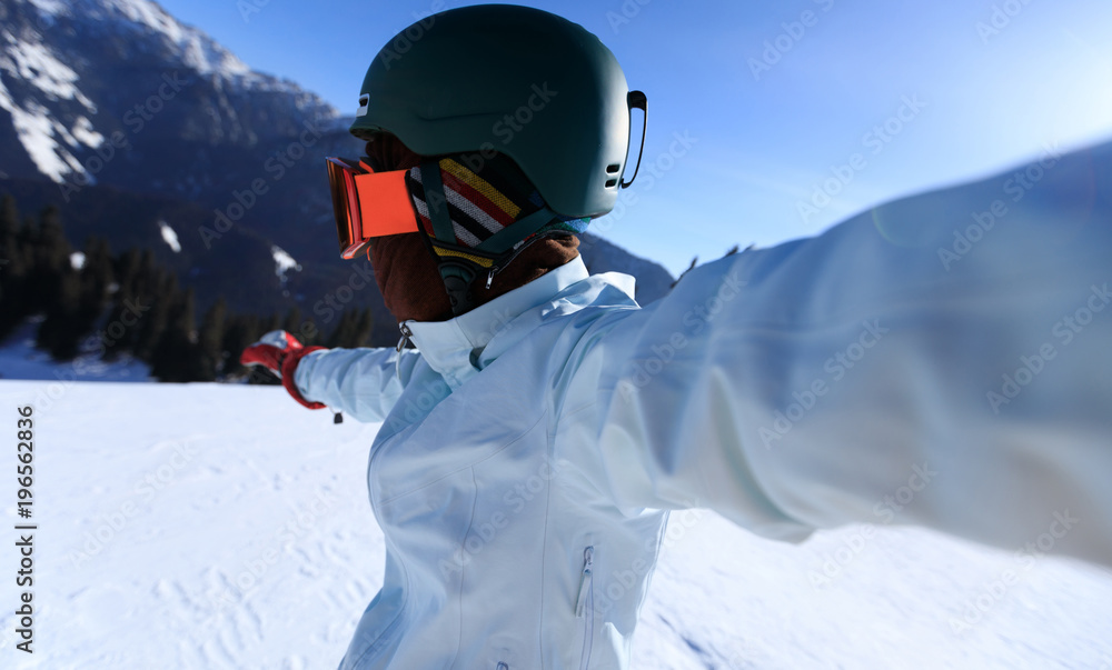 one snowboarder taking selfie on winter mountain top