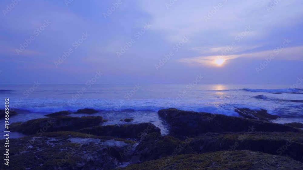 Amazing view blue sunset on the ocean beach on Bali island, waves, sky, rocks, video 4K with camera stabilizer, wonderful colors Amazing view blue sunset on the ocean beach on Bali island, waves, sky, rocks, video 4K with camera stabilizer, wonderful colors