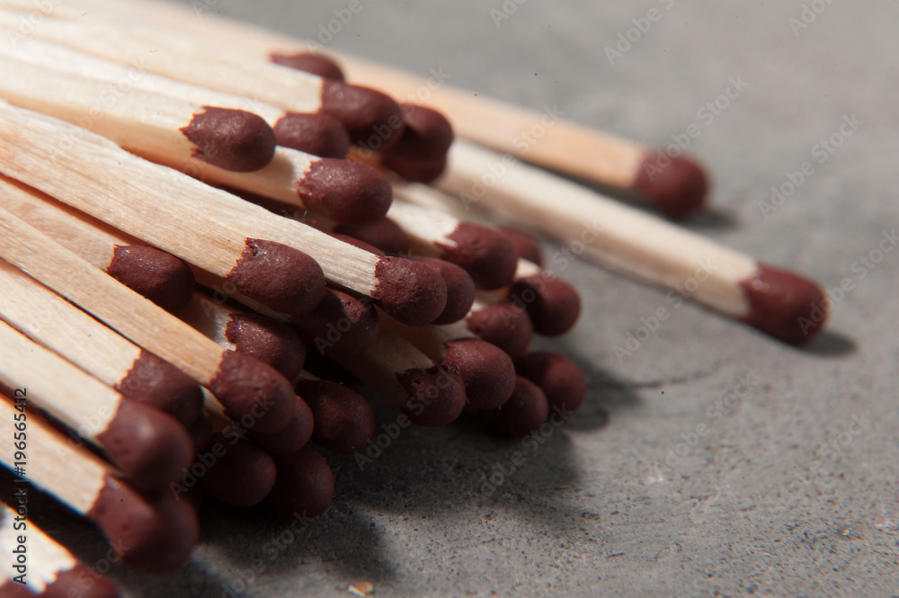 Matches fire on a gray background. Macro photo Matches fire on a gray background. Macro photo
