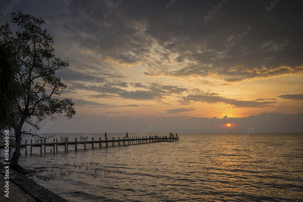 sunset and pier in kep on cambodia coast