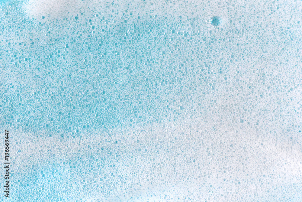 Soap foam bubbles on blue background macro close up. - obrazy, fototapety, plakaty 
