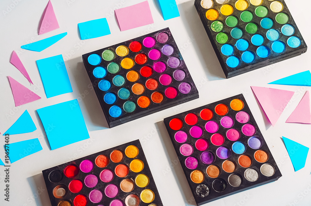 different colors of shadows. make-up artist and stylist. bright colors. minimalism. view from above different colors of shadows. make-up artist and stylist. bright colors. minimalism. view from above