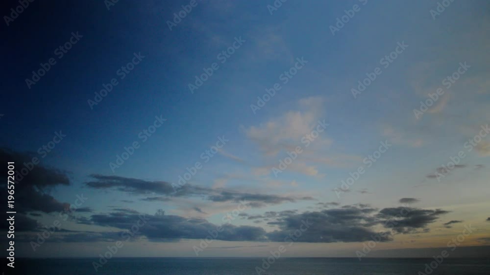 Cloudscape at sunset. The sky is gradually filled by colorful clouds. Panoramic view on a calm sea at golden hour. Timelapse scenery. 4K UHD. Cloudscape at sunset. The sky is gradually filled by colorful clouds. Panoramic view on a calm sea at golden hour. Timelapse scenery. 4K UHD.