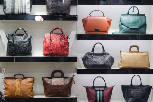 Handbags in the shop window of a fashion boutique photo