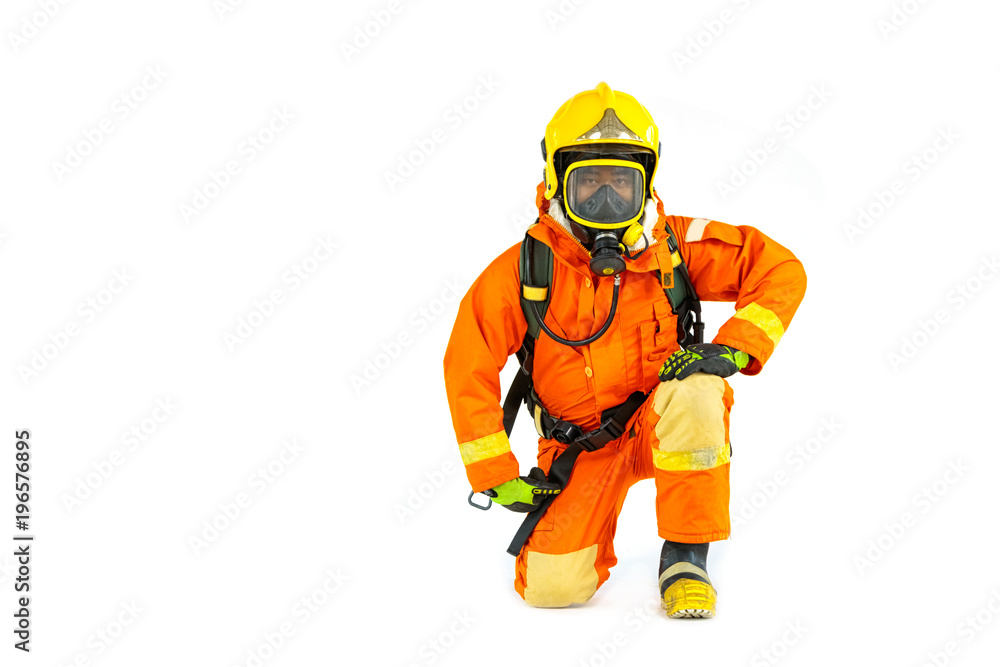 Firefighter in uniform and safety helmet standing full body length Firefighter in uniform and safety helmet standing full body length