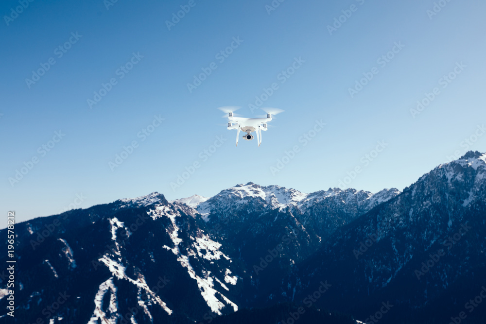 Fototapeta premium drone flying over winter mountain top