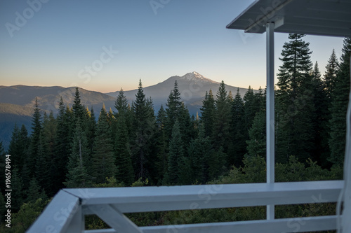 Mt Shasta from a cabin and pine trees in front