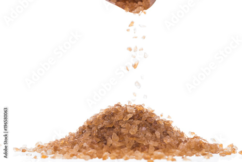 Brown rock sugar isolated on white photo