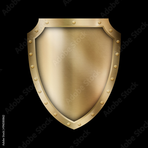 Golden antique shield with riveted border. photo