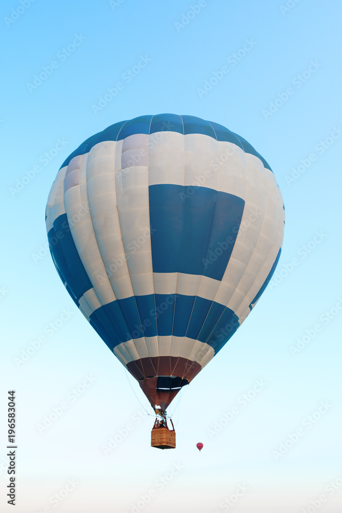 hot air balloon flies high in the blue sky hot air balloon flies high in the blue sky