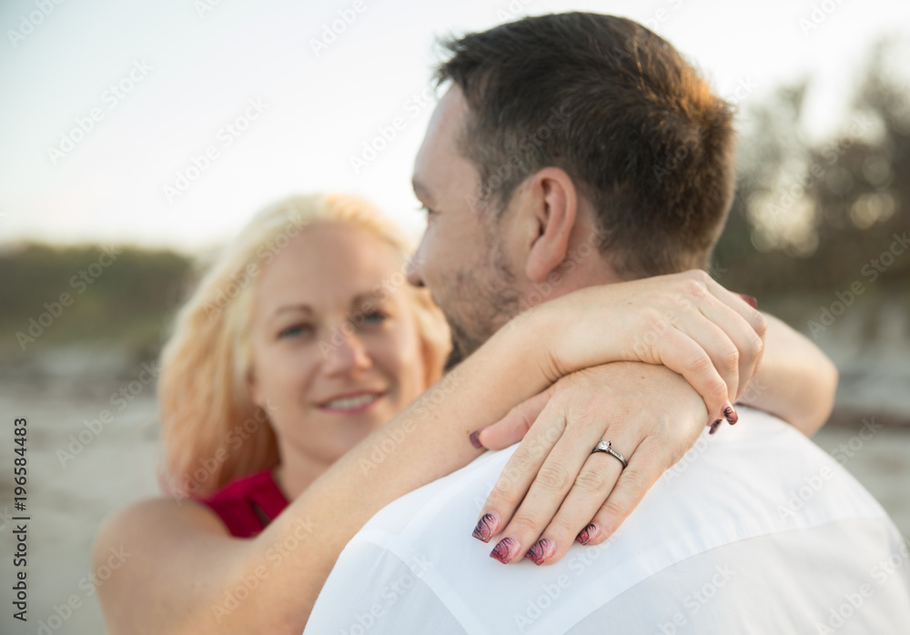 engagement ring on finger of smiling woman engagement ring on finger of smiling woman