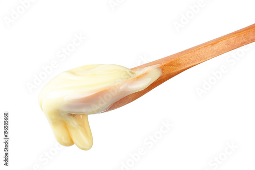 Condensed Milk in wooden spoon
 photo