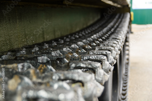 Caterpillar of a military tank or excavator. Close-up photo