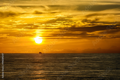 Fototapeta Naklejka Na Ścianę i Meble -  Ocean sunset on board vessel