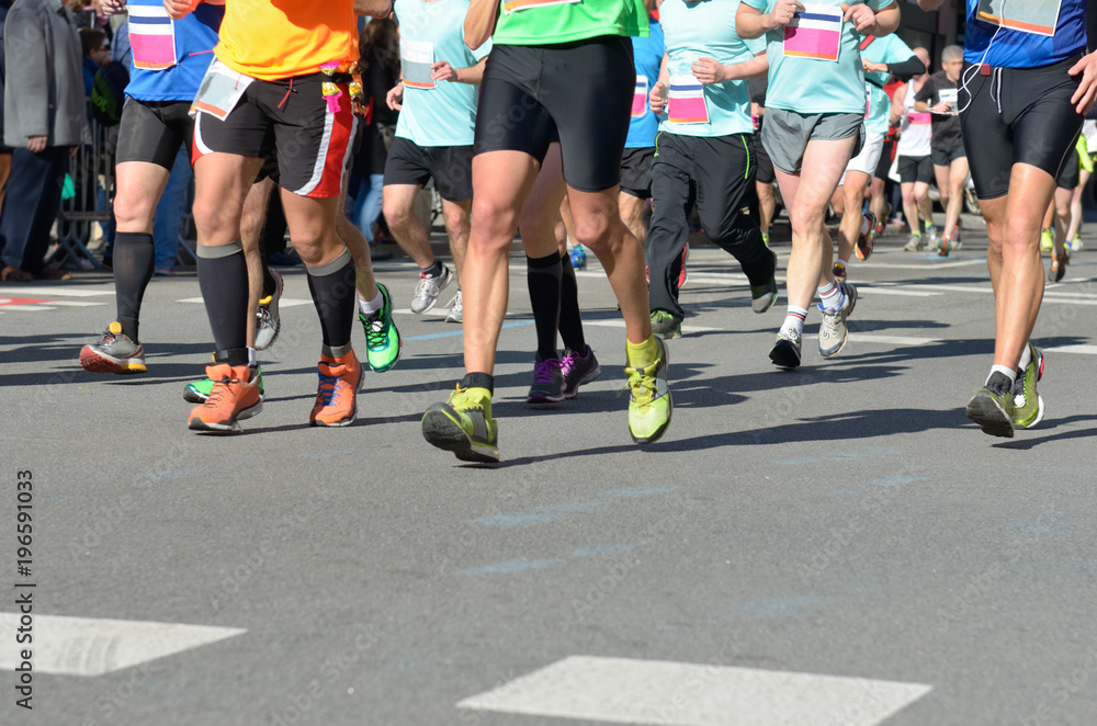 Marathon running race, many runners feet on road racing, sport competition, fitness and healthy lifestyle concept
Marathon running race, many runners feet on road racing, sport competition, fitness and healthy lifestyle concept