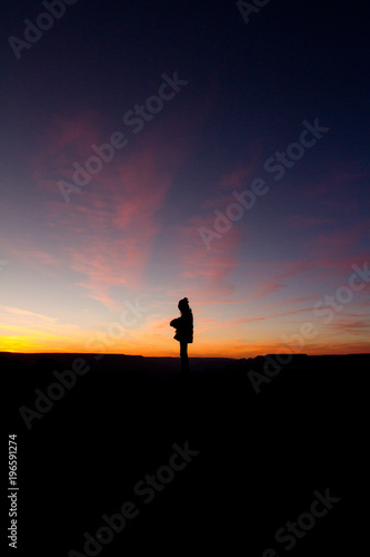Sunset silhouette of girl