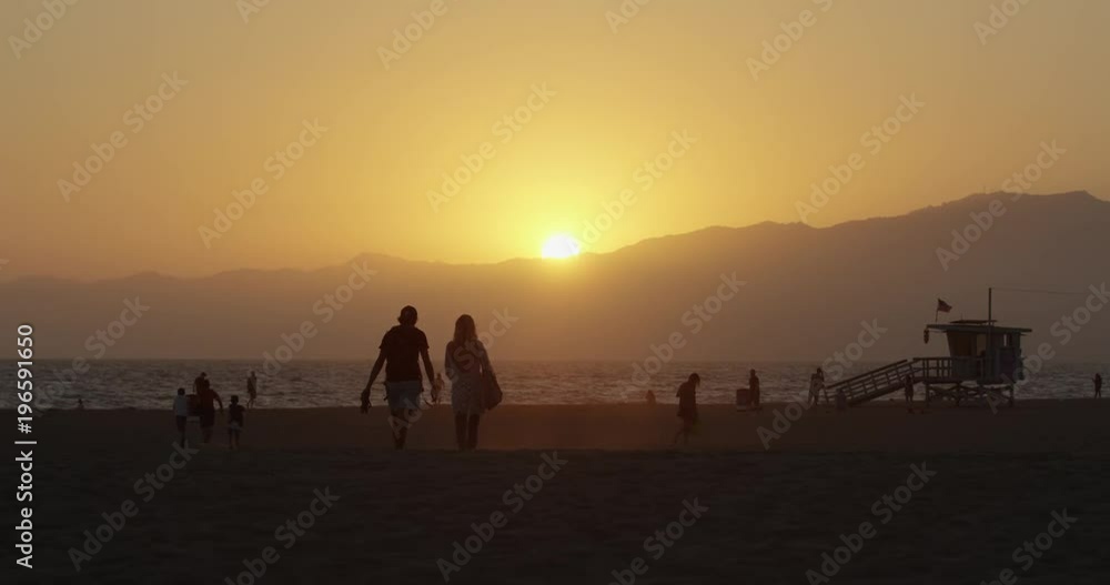 Contre jour of tourists on the beach Contre jour of tourists on the beach