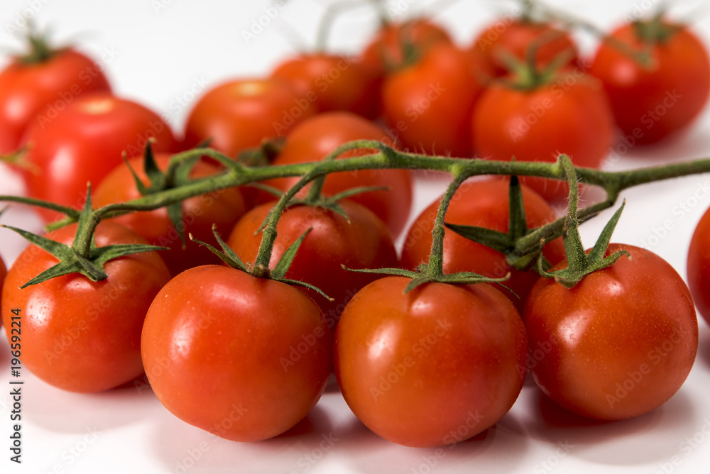cherry tomatoes, placed on a white background, macro