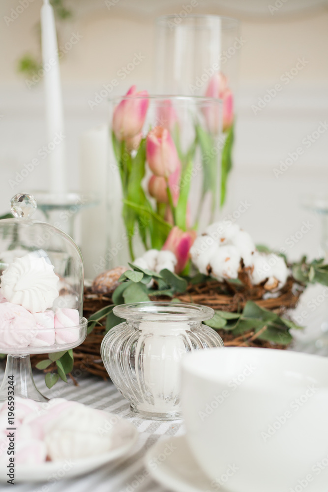 cup and white and pink marshmallow on decorated table