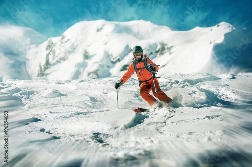 Female skiers dynamic ride in deep snow photo