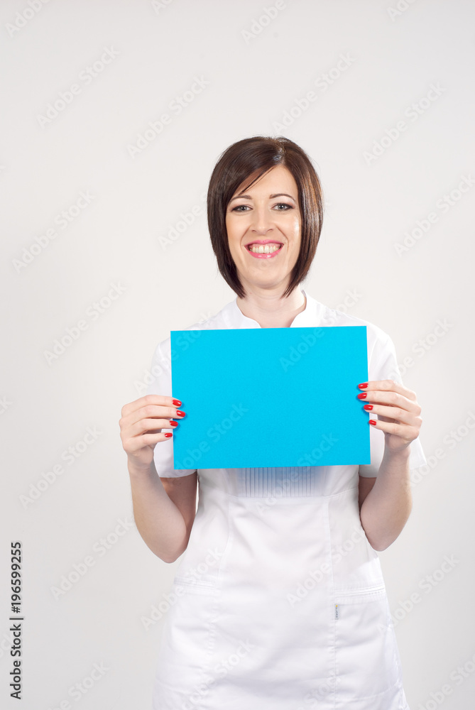 Female pharmacist holding a blank visiting card Female pharmacist holding a blank visiting card