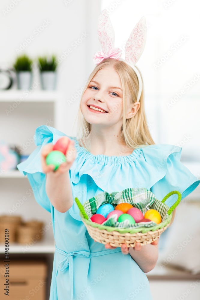 Teenage girl holding Easter eggs Teenage girl holding Easter eggs