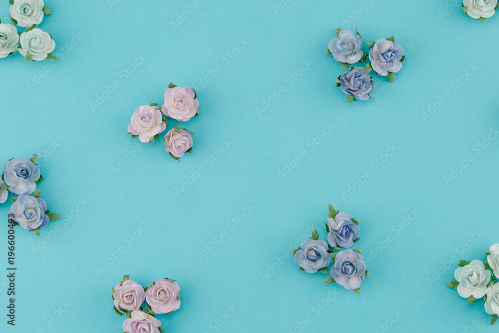Blue tone paper flowers pattern on pastel blue background Blue tone paper flowers pattern on pastel blue background