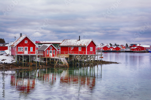 Beautiful winter landscape with traditional Norwegian fishing huts in Lofoten islands