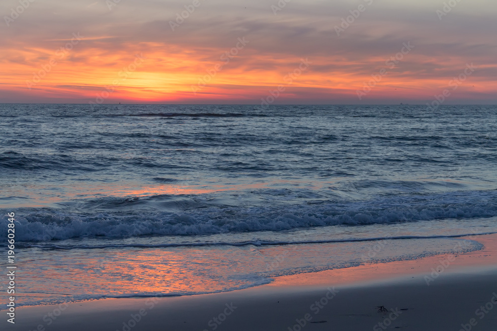 Beautiful and colorful sunset sky over the North Sea, Petten, Holland