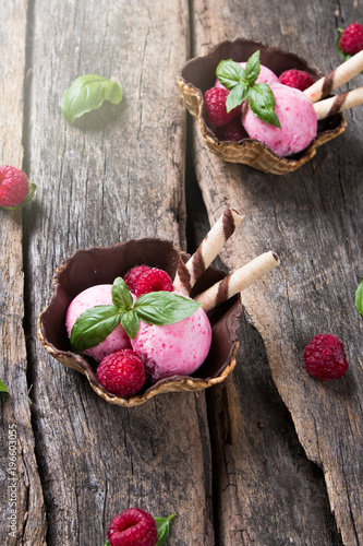 Ice cream, Raspberry sundae on wooden table.  photo