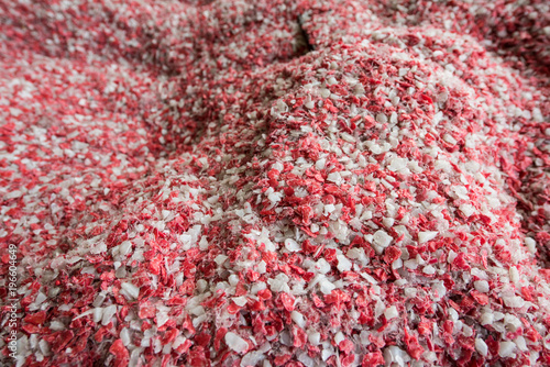 Plastic colored granulated crumb at the plant for processing and casting products from domestic and industrial waste photo