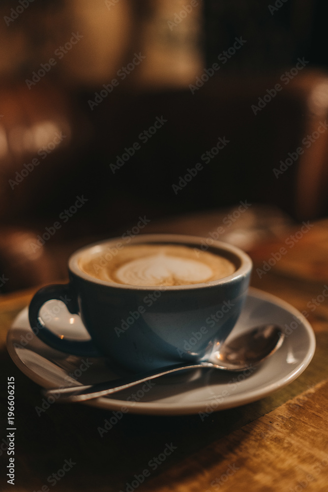 Cup of latte with heart design on table Cup of latte with heart design on table