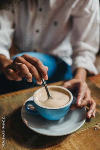 Wallpaper Mural Crop woman stirring cup of coffee Torontodigital.ca