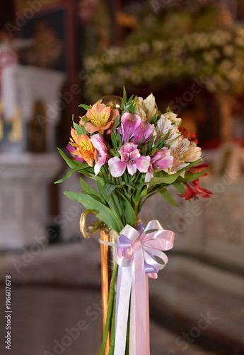 bouquet of flowers in a church. Church decoration for ceremonies. © Stratos Giannikos