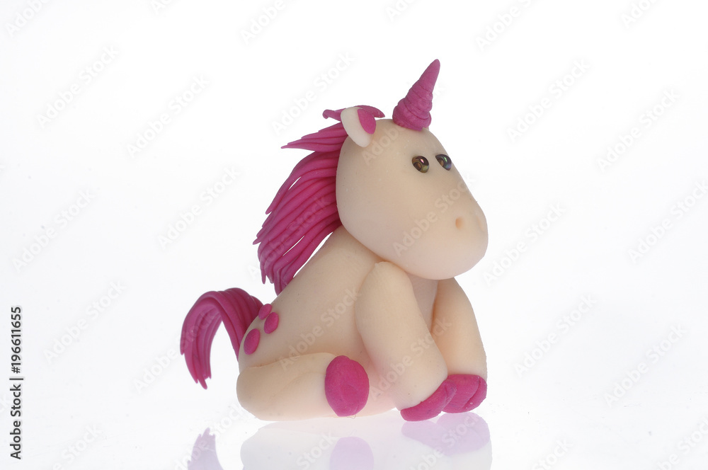 Handmade unicorns, fimo, white background Handmade unicorns, fimo, white background