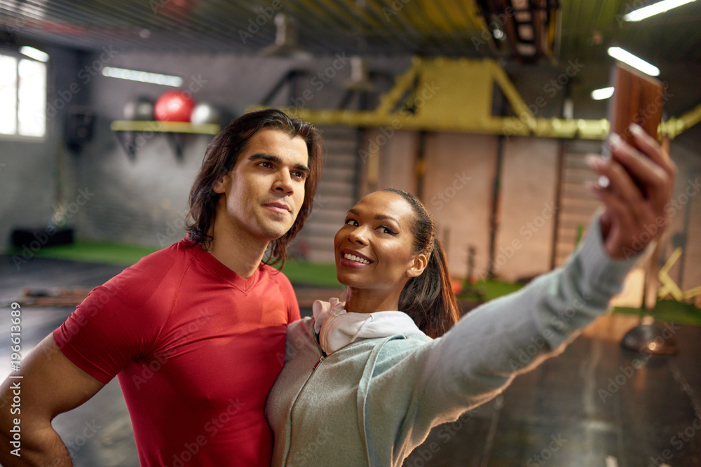 Couple making selfie in the gym